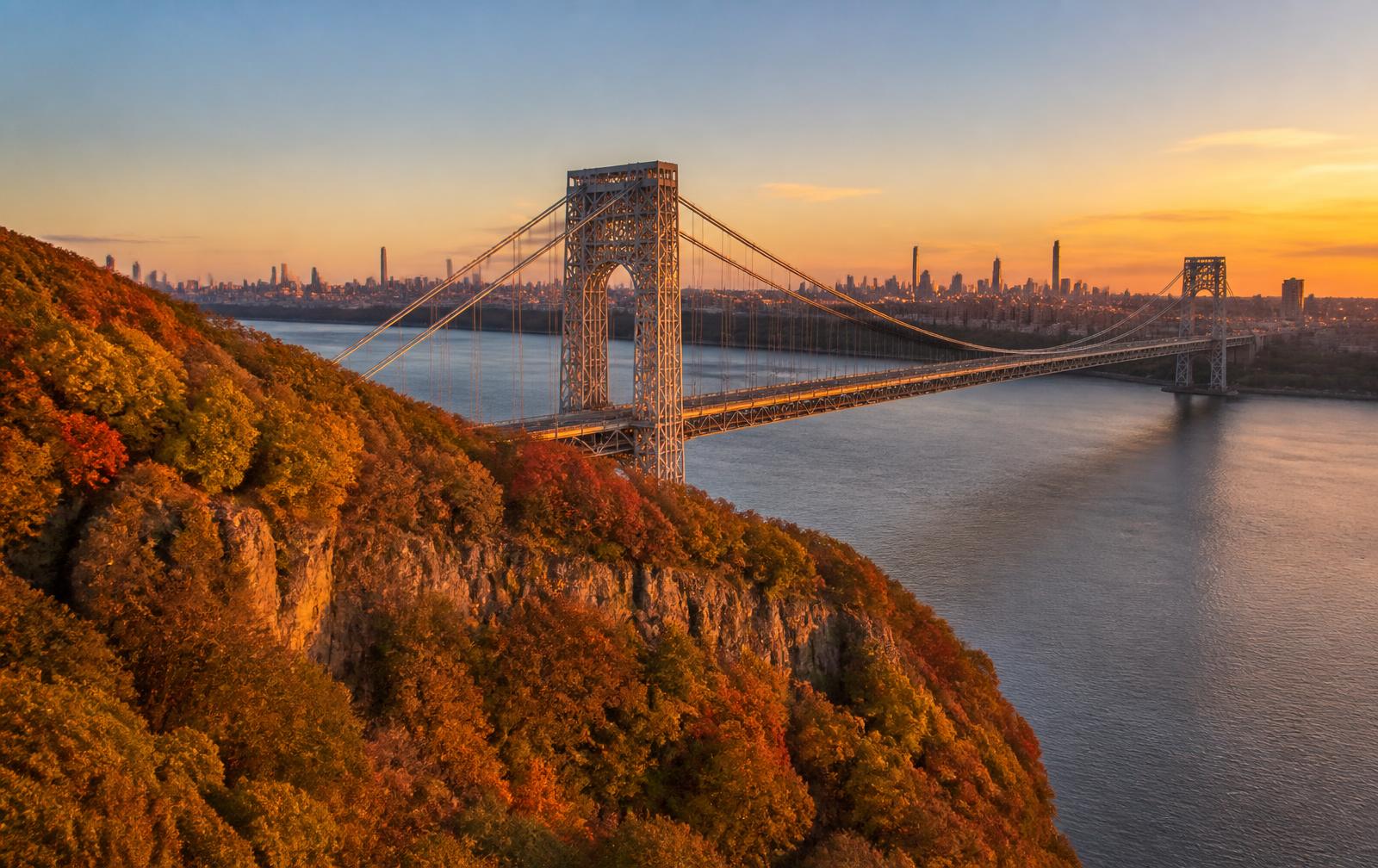 The George Washington Bridge and the New Jersey Palisades above the Hudson River at sunset